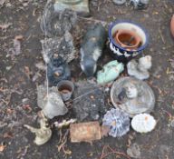 A COLLECTION OF GARDEN ORNAMENTS, including a Buddha figure, a badger, a turtle, a goose, a pair