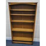 AN OAK SHALLOW OPEN BOOKCASE, with five adjustable shelves, width 92cm x depth 25cm x height