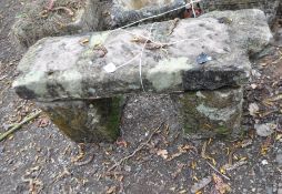 A SMALL GARDEN BENCH MADE UP FROM PERIOD SANDSTONE BLOCKS, width 68cm, depth 23cm, height 34cm.