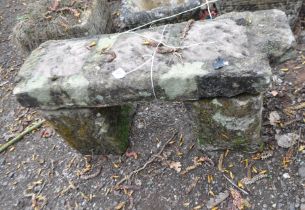 A SMALL GARDEN BENCH MADE UP FROM PERIOD SANDSTONE BLOCKS, width 68cm, depth 23cm, height 34cm.