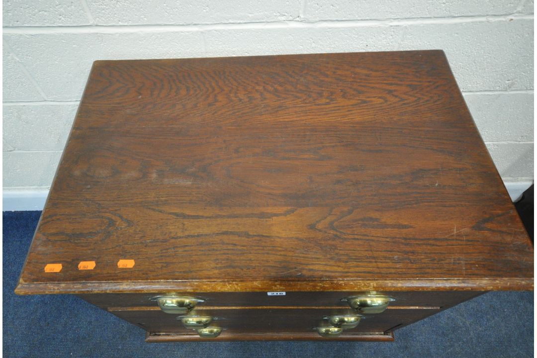 AN EARLY 20TH CENTURY STAINED OAK CHEST OF THREE DRAWERS, raised on castors, width 80cm x depth 52cm - Image 2 of 4