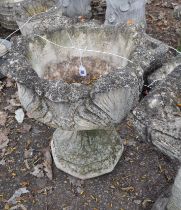A MODERN CONCRETE GARDEN URN, constructed in two pieces with acanthus leaf detail to bowl