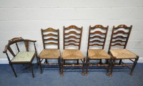 A PAIR OF OAK RUSH SEATED LADDER BACK CHAIRS, raised on shaped legs, with turned stretchers, two