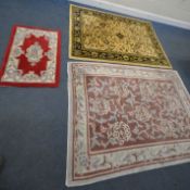 A YELLOW GROUND INDIAN RUG, with repeating foliate patterns, surrounded by a multi-strap border,