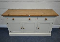 A MODERN PARTIALLY PAINTED SIDEBOARD, fitted with three drawers, over three cupboard doors, length