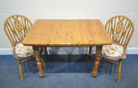 A PINE RECTANGULAR EXTENDING DINING TABLE, with a single fold out leaf, length 106cm x depth 76cm