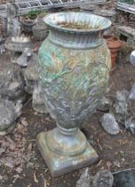 A LARGE CAST IRON URN, with grape and vine detailing, height 110cm