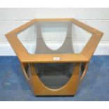 VICTOR WILKINS FOR G PLAN, A MID-CENTURY TEAK HEXAGONAL OCCASIONAL TABLE, with a glass insert,