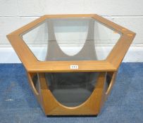 VICTOR WILKINS FOR G PLAN, A MID-CENTURY TEAK HEXAGONAL OCCASIONAL TABLE, with a glass insert,