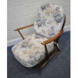 LUCIAN ERCOLANI, A MID-CENTURY ERCOL ELM AND BEECH ARMCHAIR, of deep proportions, the arched