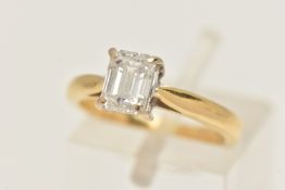 AN 18CT GOLD SINGLE STONE DIAMOND RING, a single emerald cut diamond, prong set in white gold,
