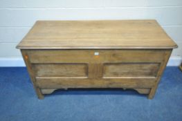 A GEORGIAN AND LATER OAK COFFER, with a hinged lid, width 141cm x depth 60cm x height 74cm,