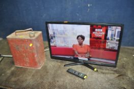 A VINTAGE 'SHELL' FUEL CAN with a brass cap (handle bent) and a Linsar 24in TV with remote (PAT pass