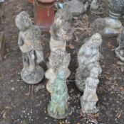 SEVEN CONCRETE GARDEN FIGURES, including a Deco style young girl, a Roman Bust, a Grecian lady