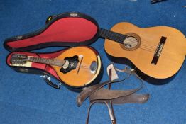 AN ACOUSTIC GUITAR AND A CASED MANDOLIN comprising a Juan Estruch of Barcelona acoustic guitar,