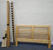 A MODERN BEECH 5FT BEDSTEAD, with siderails, slats, central support beam, and bolts, condition