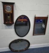 A MAHOGANY FRAMED WALL MIRROR, with twin brass finials, and foliate inlay, width 52cm x height 82cm,