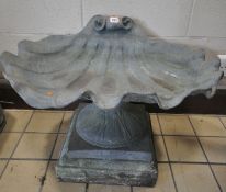 A LEAD BIRD BATH IN THE SHAPE OF A SHELL, raised on a shaped pedestal, and a separate