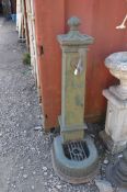 AN EARLY 20th CENTURY CAST IRON DRINKING WATER FOUNTAIN, possibly French with a fanned bronze tap,
