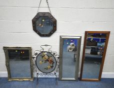 A WROUGHT IRON FIRE SCREEN, fitted with an oval mirror, depicting flowers, height 89cm, a gilt resin
