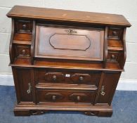 A LATE 20TH CENTURY BUREAU, of small proportions, the fall front door with a fitted interior, six