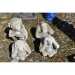 FOUR COMPOSITE MONKEY GARDEN STATUES, depicting the see no evil, hear no evil, speak no evil
