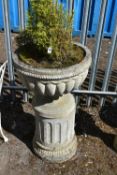 A LARGE WEATHERED COMPOSITE CAMPAGNA GARDEN URN, on a reeded pillar base, diameter 56cm x height