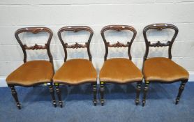 A SET OF FOUR 19TH CENTURY ROSEWOOD DINING CHAIRS, with a scrolled and foliate central bar back,