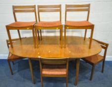 A MID-CENTURY TEAK OVAL EXTENDING DINING TABLE, with a single fold out leaf, raised on tapered legs,