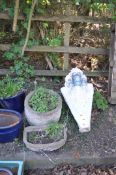 TWO CONCRETE PLANTERS AND A SCULPTURE, in the form of three heads on a tapering base etc (3)