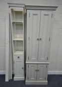 A TALL PAINTED PINE CABINET, with two large over two small cupboard doors, width 75cm x depth 48cm x