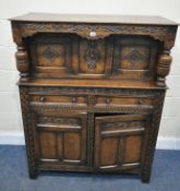 AN EARLY 20TH CENTURY OAK COURT CUPBOARD, fitted with four assorted drawers, and two drawers,