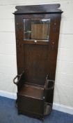 A 20TH CENTURY OAK HALL STAND, with a bevelled edge mirror, four hooks, a hinged seat, flanked by