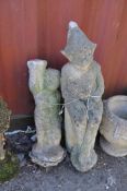 A MODERN CONCRETE GARDEN FIGURE, in the form of a gnome sat atop a tree stump, height 93cm (cap