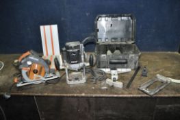 A TREND T11E 1/2in ROUTER WITH CASE, accessories, and an Evolution track saw with three 34cm