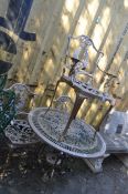 A CAST ALUMINIUM GARDEN TABLE AND THREE SIMILAR CHAIRS, table has pierced fretwork retailing to 80cm