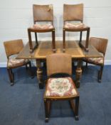 A 20TH CENTURY OAK DRAW LEAF DINING TABLE, raised on block and turned legs, united by a cross