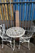 A PAINTED CAST ALUMINIUM CIRCULAR GARDEN TABLE, diameter 74cm x height 73cm, two armchairs and a