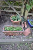 A SELECTION OF TERRACOTTA GARDEN POTS, including a rectangular planter, a half moon planter both
