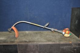 A HUSQVARNA 322C PETROL STRIMMER (engine pulls freely but hasn't been started)