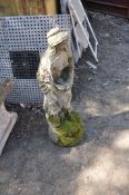 A CONCRETE GARDEN FIGURE, in the form of a busty maiden, height 85cm, Condition Report weathering to
