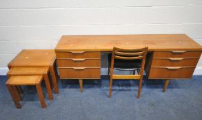 AUSTINSUITE, A MID-CENTURY TEAK DRESSING TABLE, fitted with six drawers, raised on tapered legs,