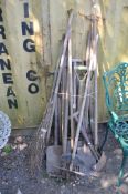 A COLLECTION OF WOODEN HANDLED GARDEN, TOOLS including spades, forks , hoes, rakes etc