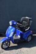 A VELECO ZT15 BLUE THREE WHEELED SCOOTER, with two chargers, waterproof cover and manual,