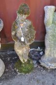 A CONCRETE GARDEN FIGURE, in the form of a scantily clad flower girl, height 81cm Condition
