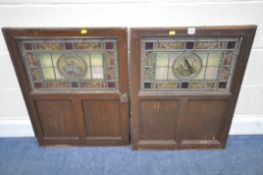 TWO STAINED PANELS, each with a rectangular stained glass lead glazed window pane, depicting foliate