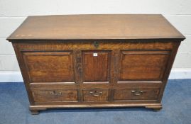 A GEORGIAN OAK COFFER, with a hinged lid, and three sized drawers, width 136cm x depth 56cm x height