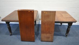 TWO MAHOGANY WIND OUT DINING TABLES, both with an additional leaf, and winding handles, largest