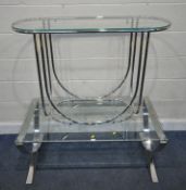 A RECTANGULAR GLASS COFFEE TABLE, raised on chrome cross shaped legs, length 110cm x depth 60cm x