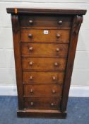 A 19TH CENTURY MAHOGANY WELLINGTON CHEST, fitted with seven graduated drawers, and a hinged